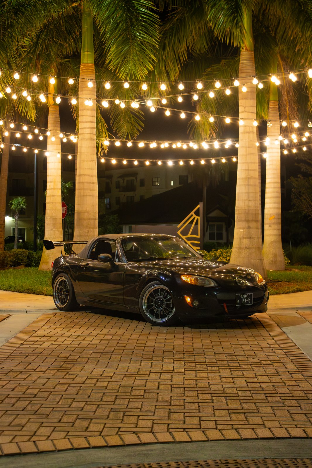 Mazda MX-5 badge and tail light detail shot — JDM automotive close-up