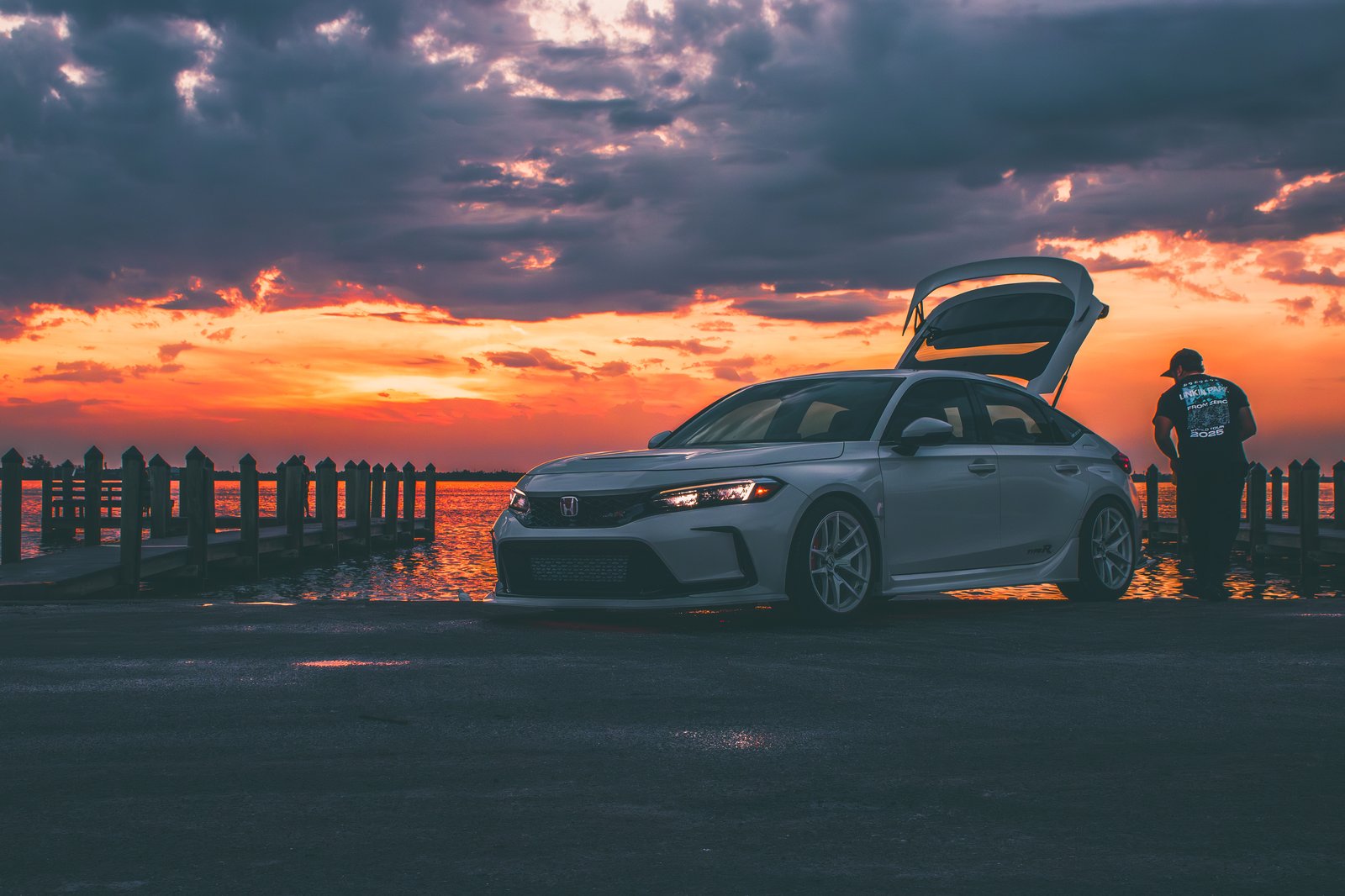 White Honda Civic Type R with hatch open at sunset over Florida water — premium automotive portrait