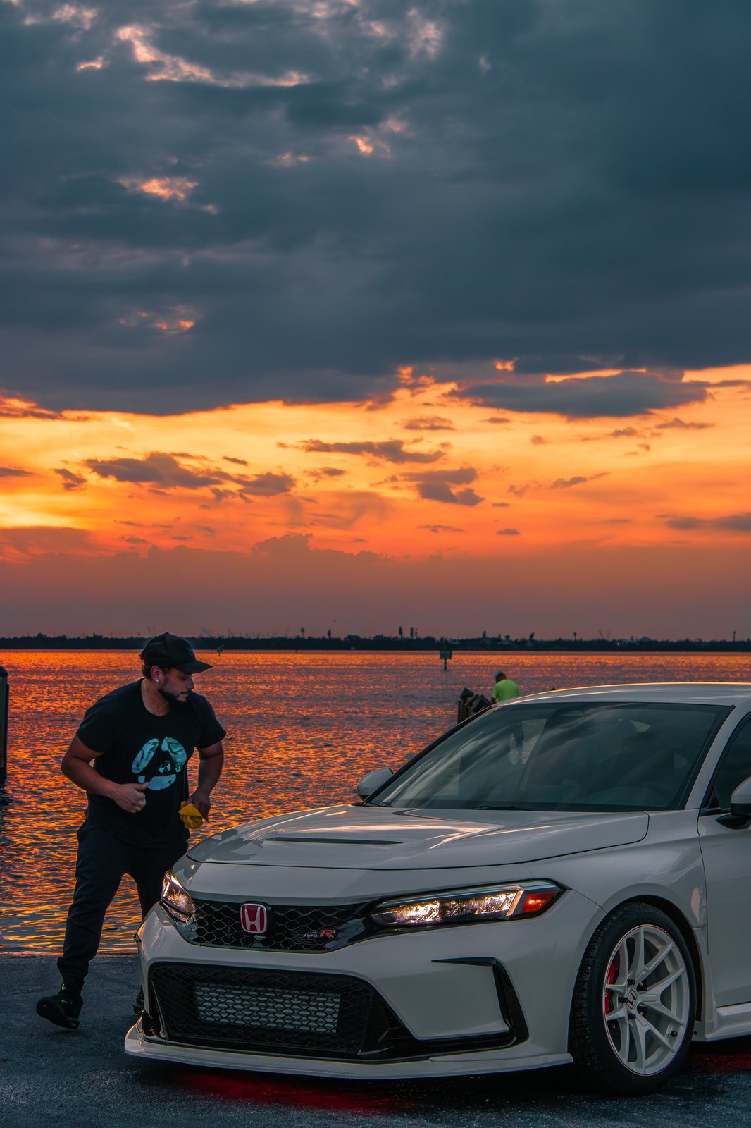 Behind the scenes — photographer with white Civic Type R at Florida sunset waterfront shoot
